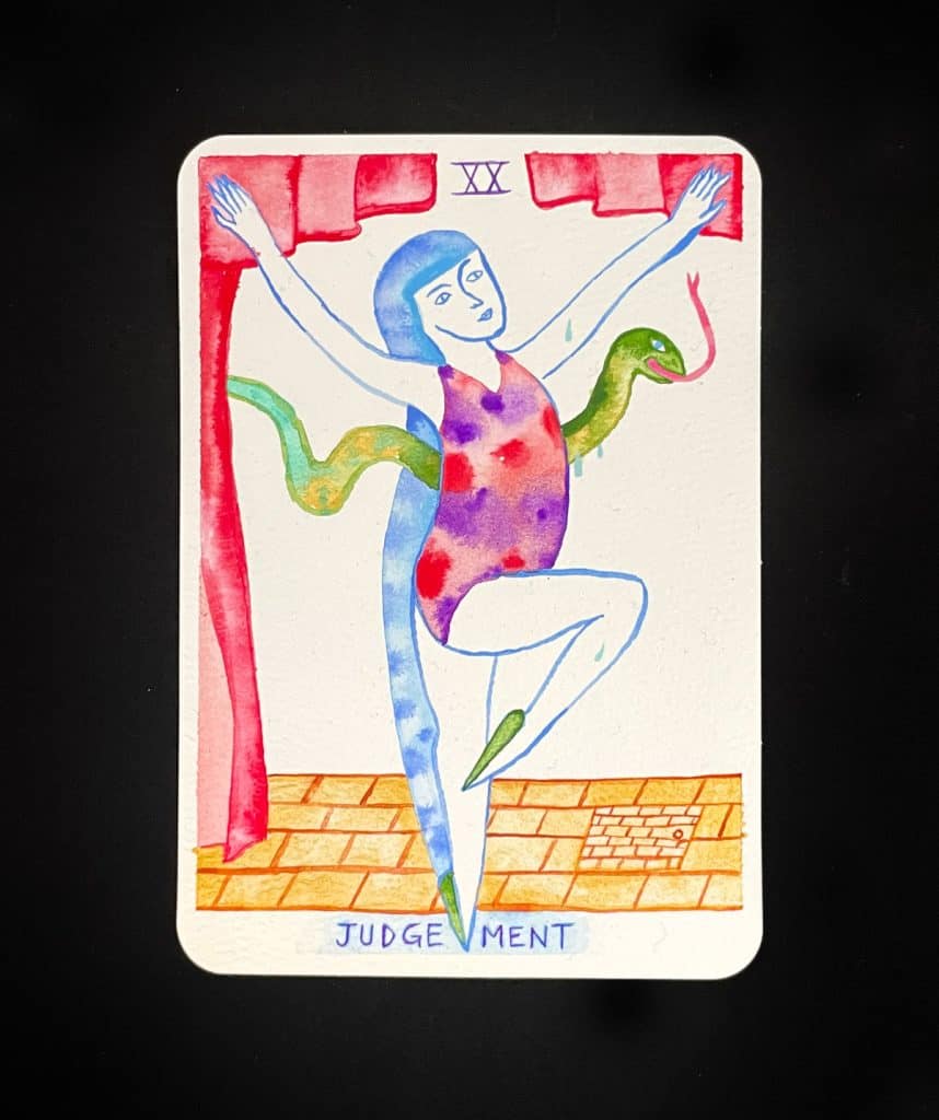 A hand-painted tarot card by Rebecca (the Judgement card) that shows a figure dancing precariously with a snake on a theater stage