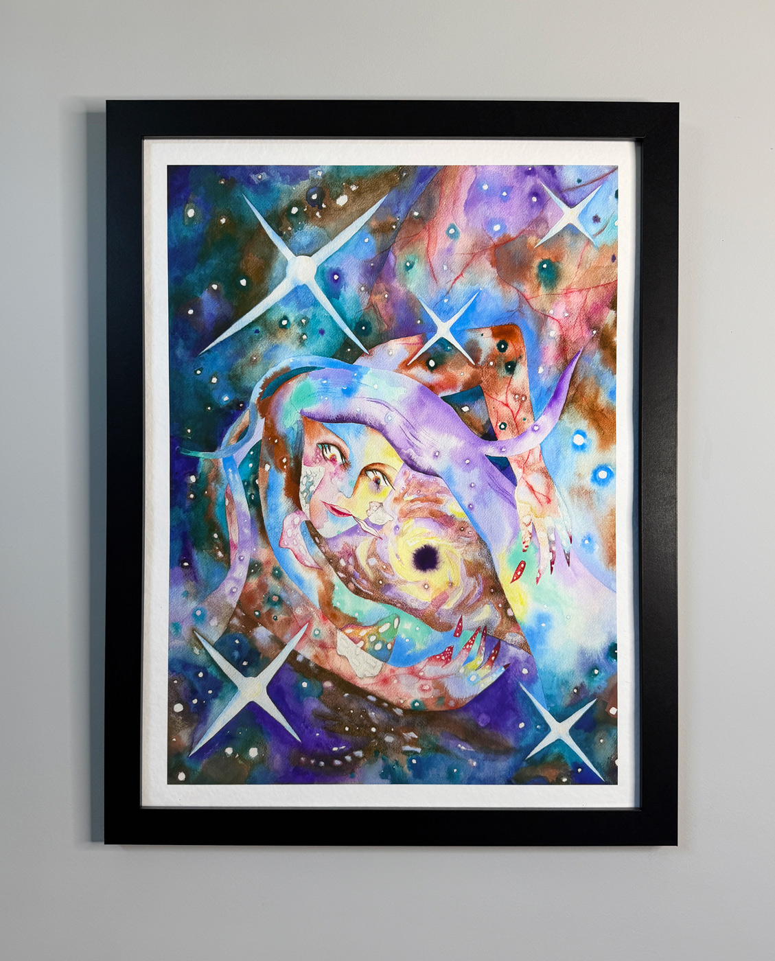 This image shows Rebecca's print, the Black Hole of Circinus, framed on the wall to show how it looks when framed.